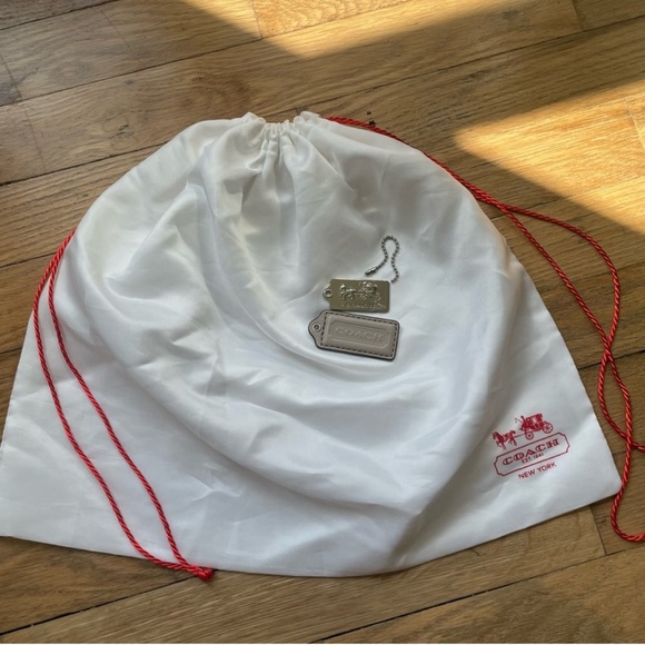 SOLD ✨Coach White  dust Bag with Red Accents
2 hand tag 
1 dust bag - Picture 1 of 2